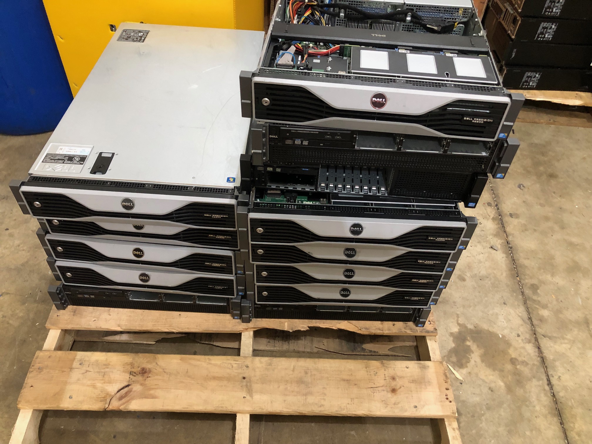 A pallet of used computer equipment ready for recycling and resale sorting