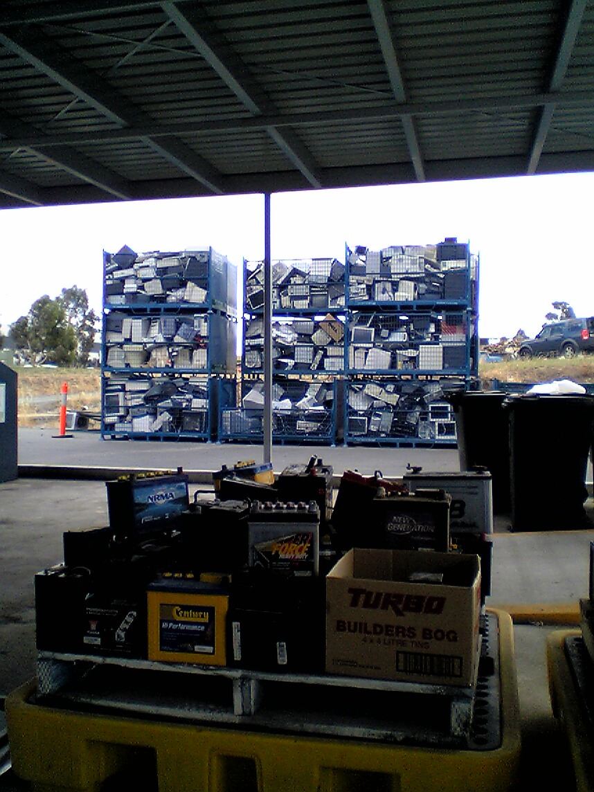 Steel mesh pallets filled with used computers and electronic equipment